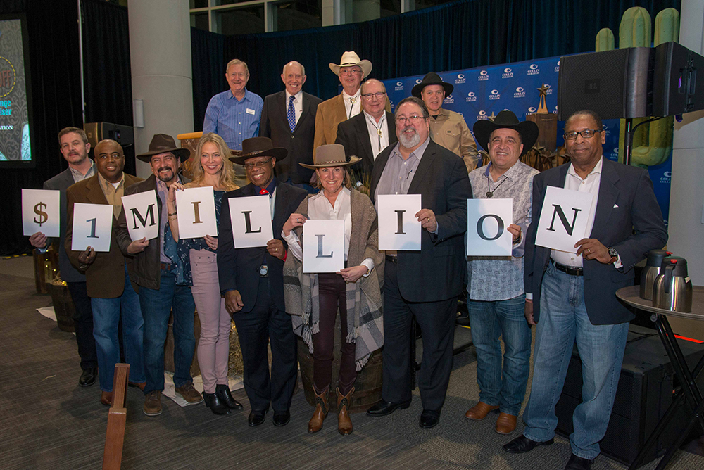 Collin College Trustees and Foundation Board members celebrate the announcement of $1 million in scholarships to be given away. Pictured from left are (front row) Craig Overstreet, Robert Scott, Adrian Rodriguez, Kim Moore, Fred Moses, Tammy McSwain, Dr. Neil Matkin, Maher Maso and Keith Wright and (back row) Shep Stahel, Dr. Bob Collins, Milton Buschbom, Andy Hardin and Jim Orr.