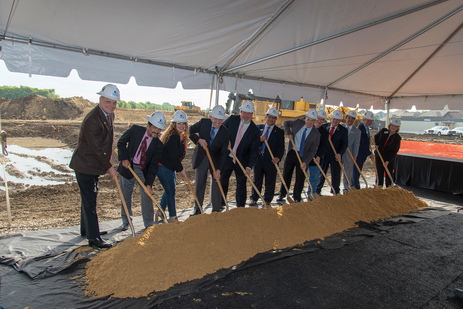 Collin College Board of Trustees members and honored guests break ground at the Collin College Technical Campus site in Allen, Friday, Sept. 7. (From left) Trustee Steve Matthews, Trustee Adrian Rodriguez, Trustee Dr. Stacey Donald, Trustee Dr. J. Robert Collins, Collin College President Dr. Neil Matkin, Trustee Dr. Raj Menon, Trustee Jim Orr, Trustee Andrew Hardin, Allen Mayor Stephen Terrell, Allen Economic Development Corporation President Michael Schaeffer, Allen Independent School District Superintendent Dr. Scott Niven and Allen ISD Board of Trustees Vice President Amy Gnadt.