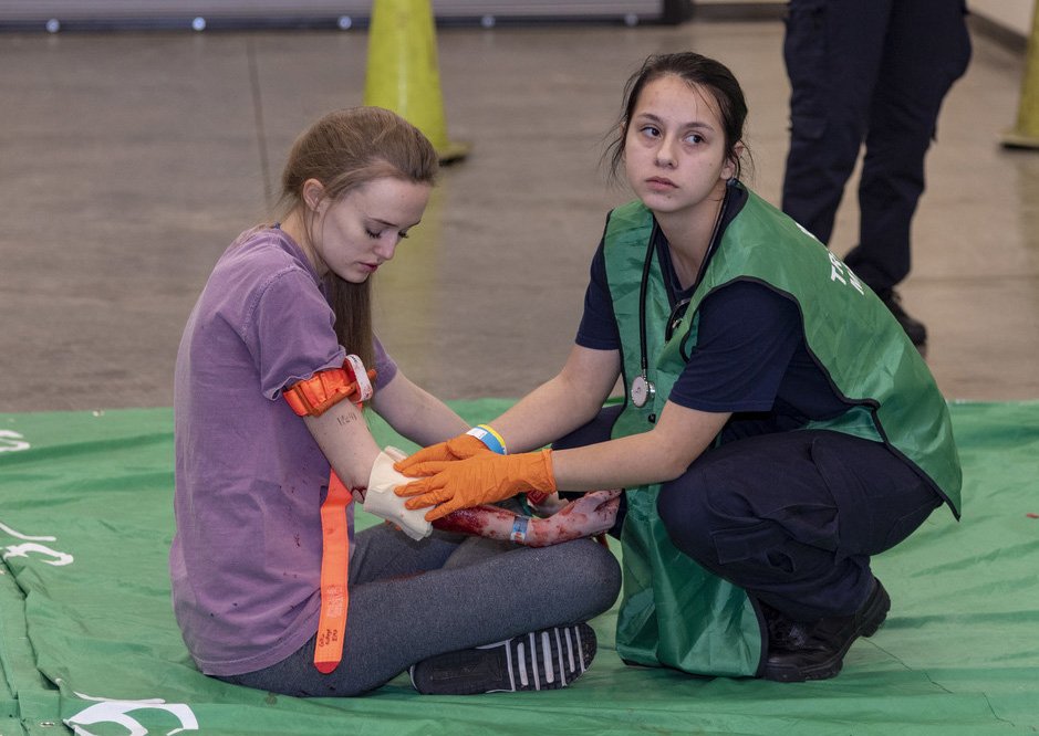 A Collin College dual credit EMT student treats a "patient" during a simulated mass casualty incident, March 7.
