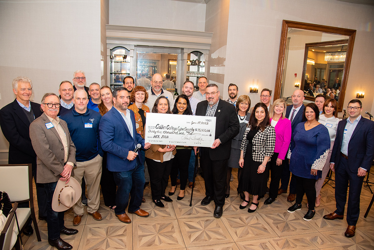 Representatives from Collin College joined members of the North Texas Information Security Systems Association for a photo after announcing a $35,000 check to Collin College earmarked for Cybersecurity students.